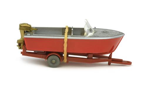 Motorboot auf Anhänger, rot/silbern